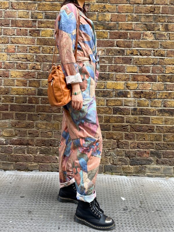 model wearing late 1980s geometric jumpsuit with drop shoulder fit