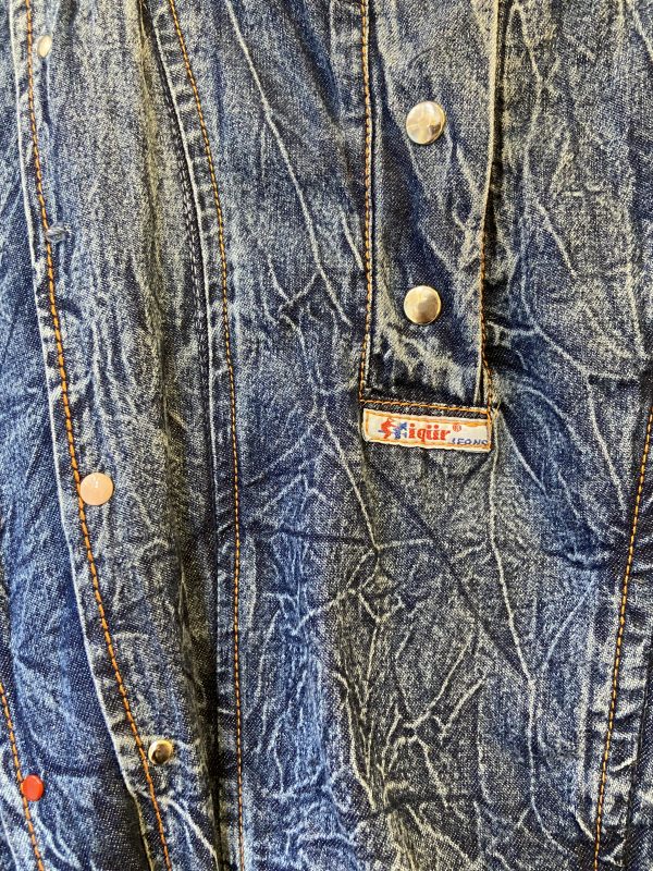 detail of crinkled denim fabric on 1980s dress