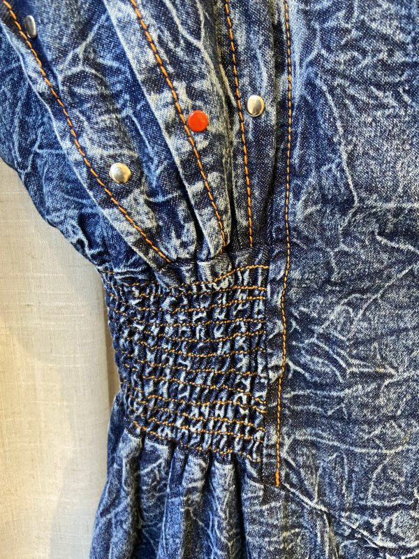 detail of crinkled denim fabric on 1980s dress