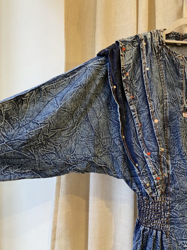 detail of crinkled denim fabric on 1980s dress