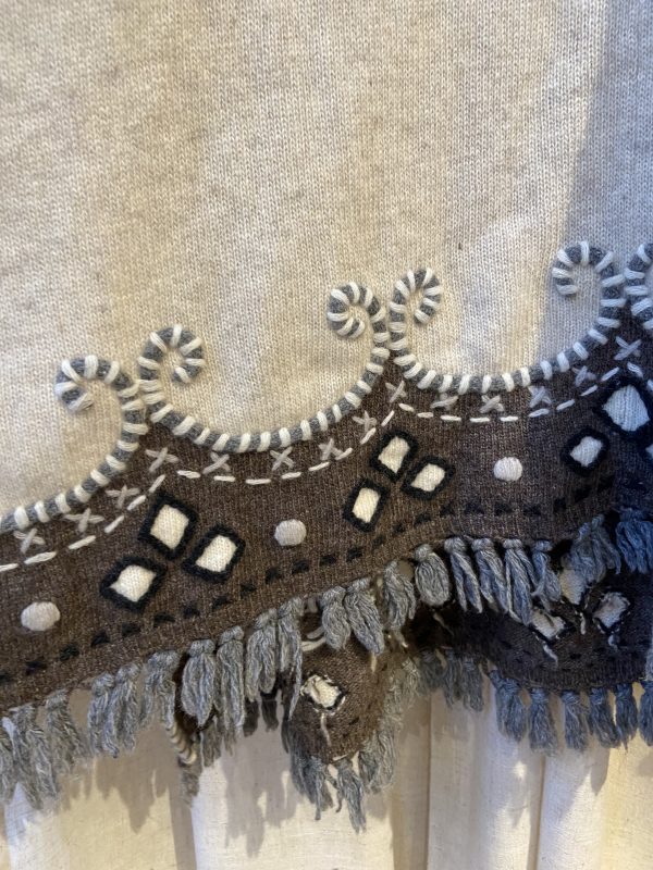Late 1990s embroidered poncho with colourful floral embroidery and boho fringe hem