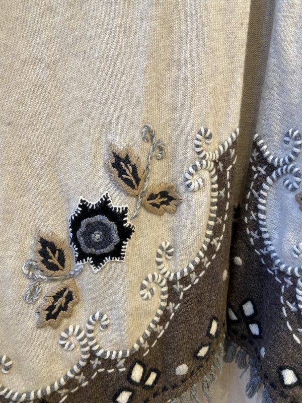 Late 1990s embroidered poncho with colourful floral embroidery and boho fringe hem