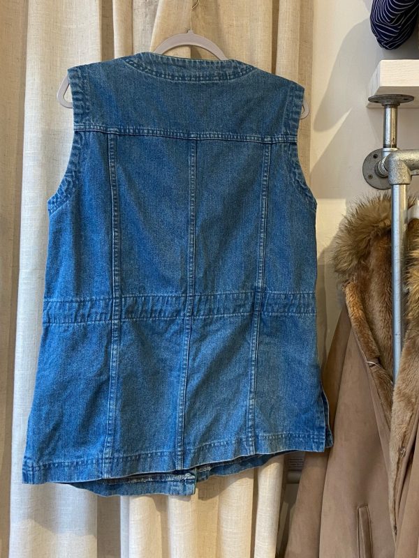 Back of vintage denim waistcoat with detailed mountain embroidery and drawstring waist