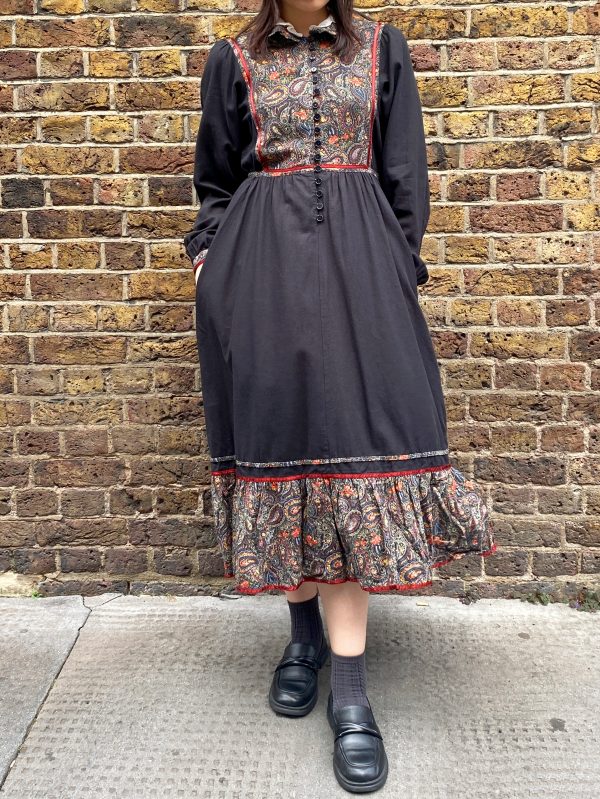 model wearing late 1970s prairie dress with puffed sleeves