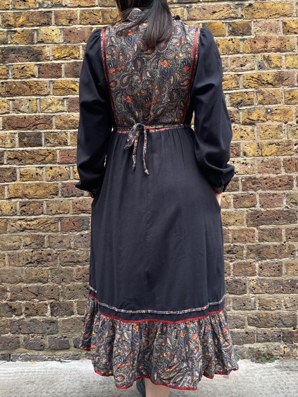 model wearing late 1970s prairie dress with puffed sleeves