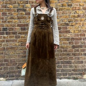 model wearing 1980s Bavarian suede dress vintage garment