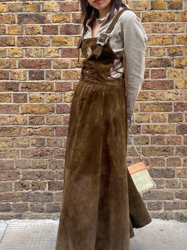 model wearing 1980s Bavarian suede dress vintage garment