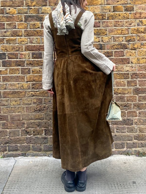 model wearing 1980s Bavarian suede dress vintage garment