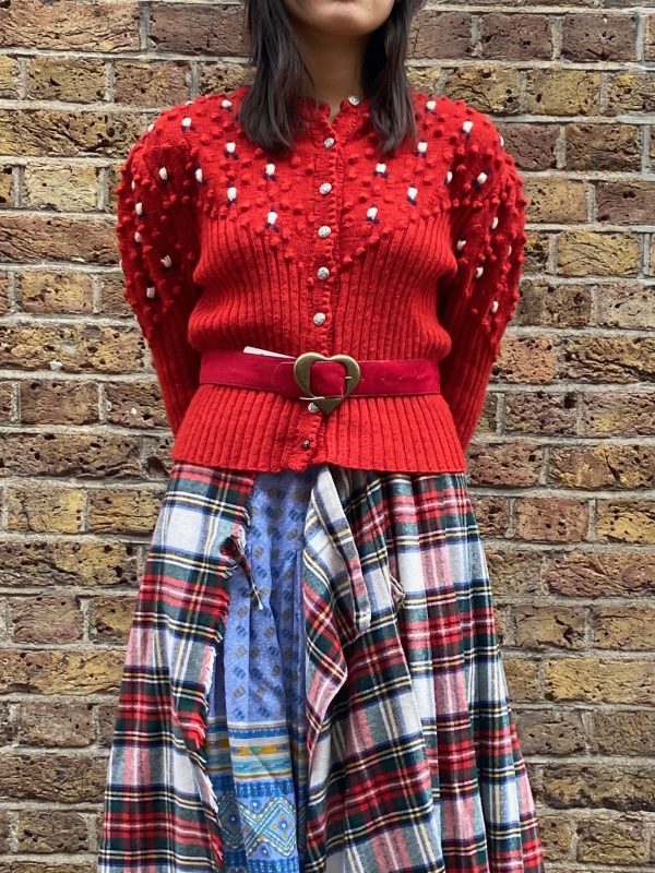 Vintage 1940s red bobble knit cardigan styled with relaxed fit on model, UK size 8