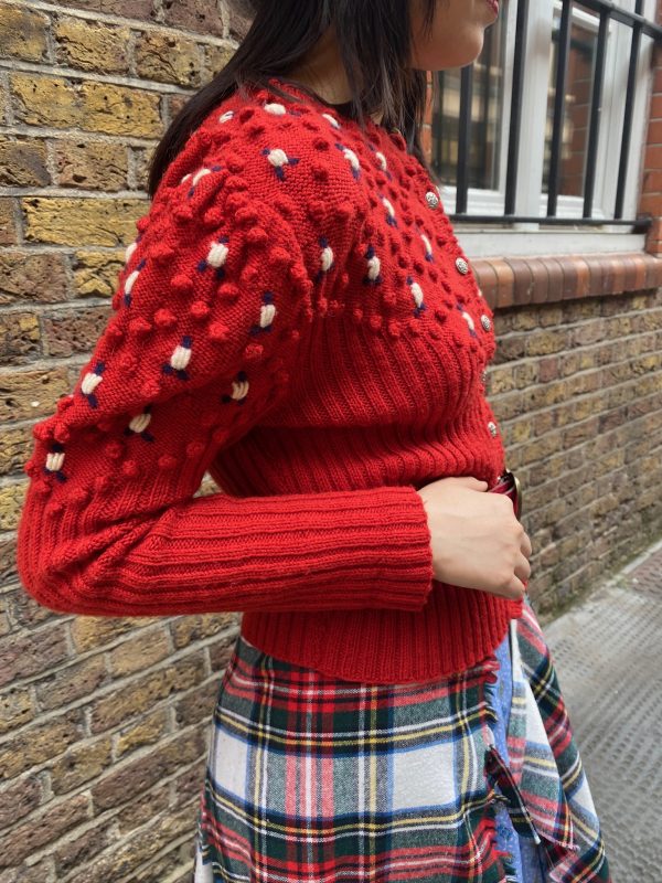 Vintage 1940s red bobble knit cardigan styled with relaxed fit on model, UK size 8