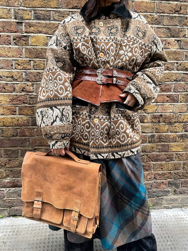Model wearing 1960s plaid A-line skirt