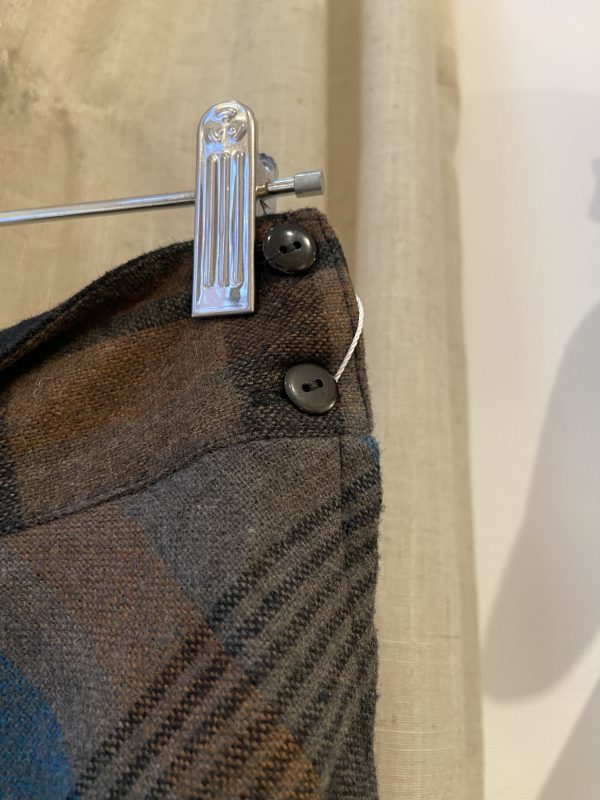 Close-up of blue and grey plaid wool-blend fabric on vintage 1960s A-line skirt.