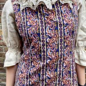 1980s vintage lace linen blouse with puff sleeves with a dress