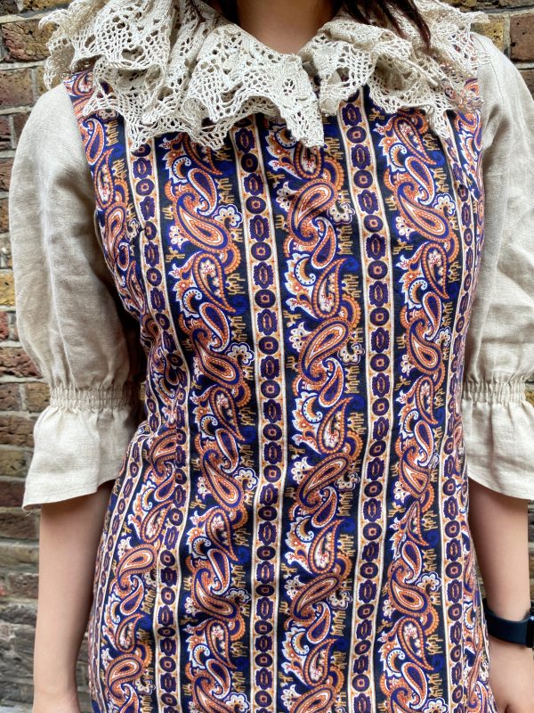1980s vintage lace linen blouse with puff sleeves with a dress