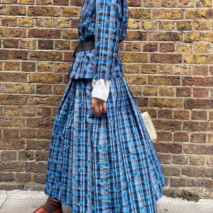 Side view of early 1980s silk check skirt and top set, showing soft pleats and mid-calf length.