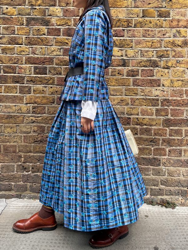Side view of early 1980s silk check skirt and top set, showing soft pleats and mid-calf length.