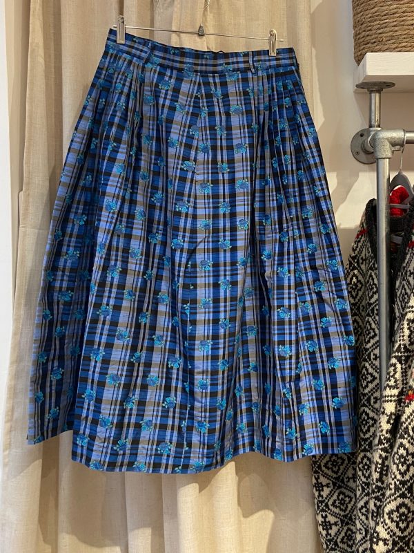 Front view of early 1980s silk check skirt in blue and brown plaid with pleats, made by Country Line.