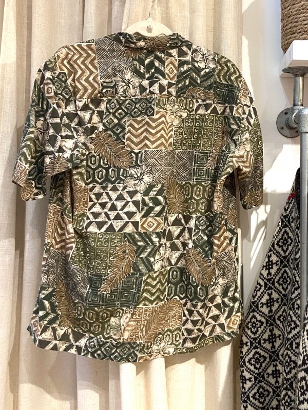 Back view of 1980s Hawaiian shirt featuring zig-zag and botanical motifs