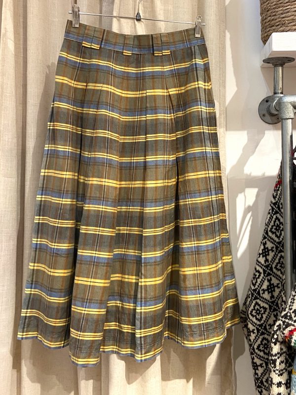 Flat lay of 1970s wool-blend skirt with classic pleats and structured high waist, made by Bogner.