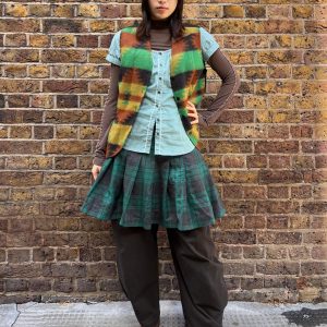Front view of 1990s wool waistcoat laid flat showing geometric pattern