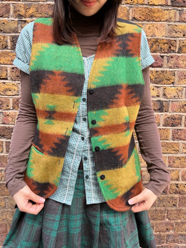 Full-length side view of model wearing vintage wool waistcoat