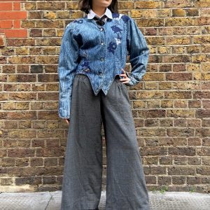 Model wearing 1980s Marciano denim jacket with asymmetrical hem