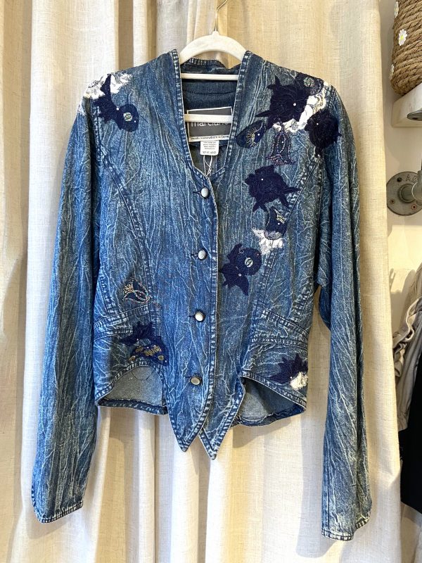 Front view of 1980s Marciano denim jacket with floral embroidery