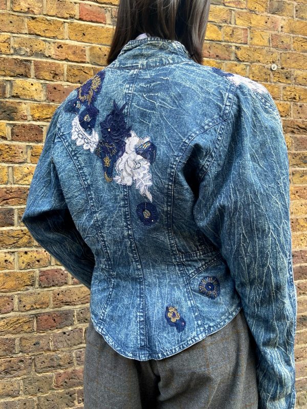 Back of vintage Marciano denim jacket showing embroidery details