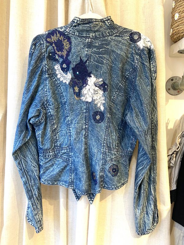 Back of vintage Marciano denim jacket showing embroidery details