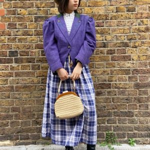Model wearing 1970s Alpine jacket with embroidery