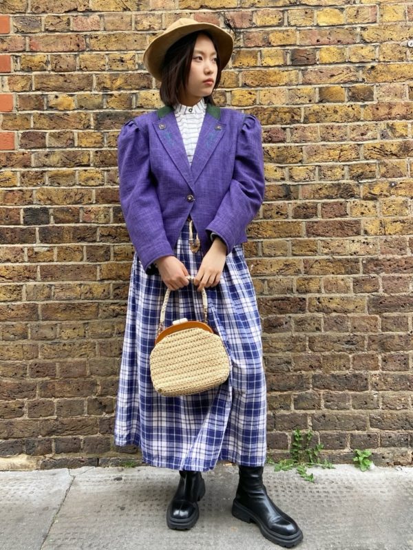 Model wearing 1970s Alpine jacket with embroidery