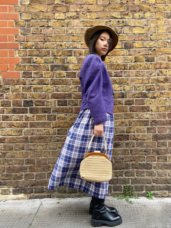 Model wearing 1970s Alpine jacket with embroidery