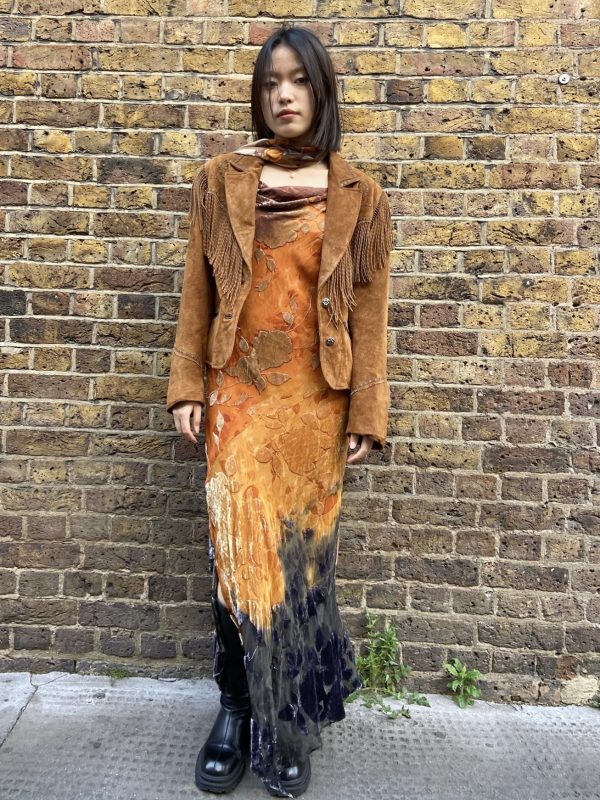 Model wearing suede fringe Western jacket by Cripple Creek from early 2000s