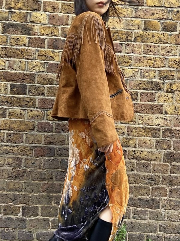 Model wearing suede fringe Western jacket by Cripple Creek from early 2000s
