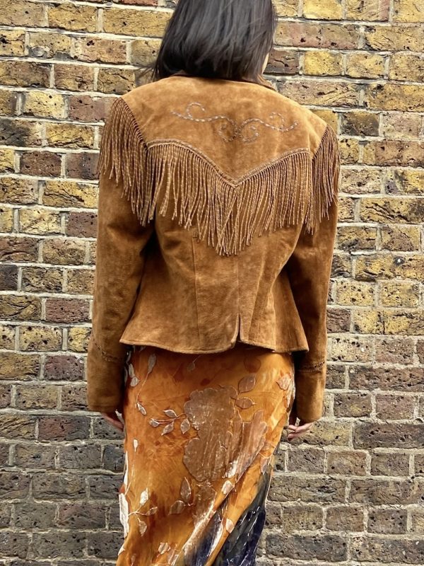Model wearing suede fringe Western jacket by Cripple Creek from early 2000s