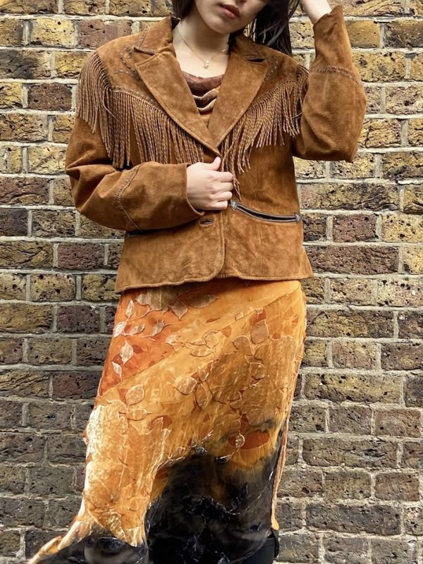 Model wearing suede fringe Western jacket by Cripple Creek from early 2000s