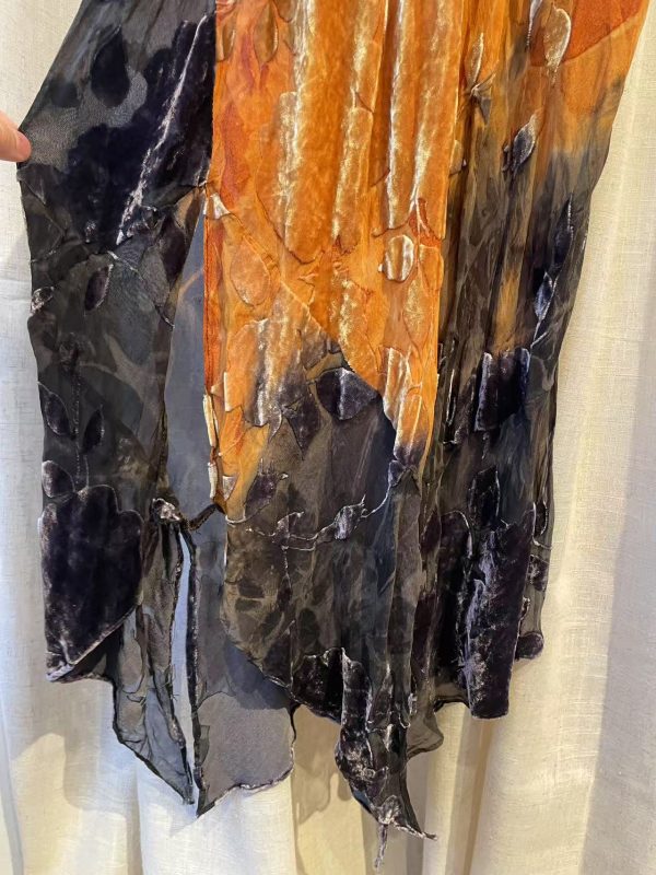 Close-up of devoré velvet fabric showing floral pattern and sheer texture