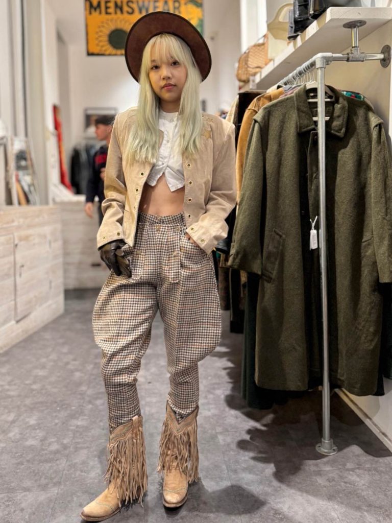 Model wearing Early 1960s wool tweed jodhpurs by Bonnie Cashin for Sills from the 100-year-old ambassador wardrobe, styled in a vintage shop