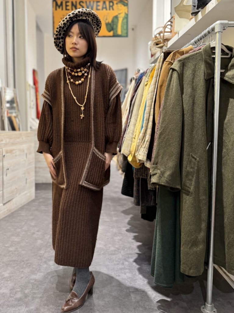 Model wearing a late 1970s mohair knit set from the 100-year-old ambassador wardrobe, ribbed turtleneck dress with matching sleeveless cardigan in a vintage shop