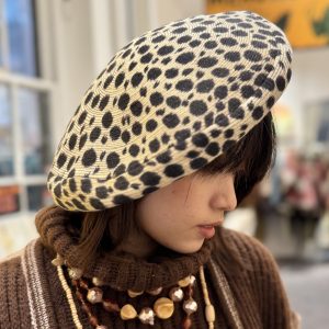 Close-up of flocked velour texture on 1950s leopard print beret