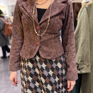 Model wearing 1990s velour blazer in chestnut brown with embossed floral texture