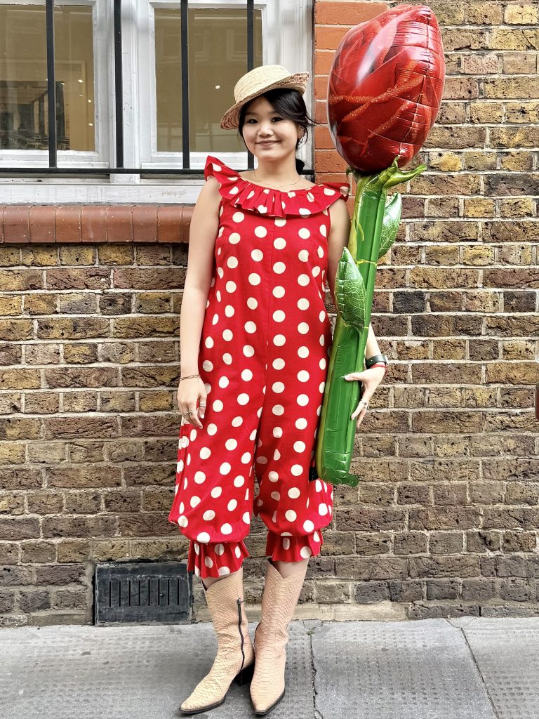 1950s Lord & Taylor Jumpsuit in red and cream polka dots worn with vintage cowboy boots