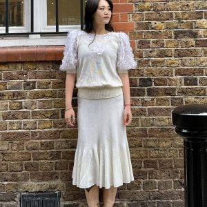 1980s French knit set with floral appliqué puff sleeves and matching cream skirt